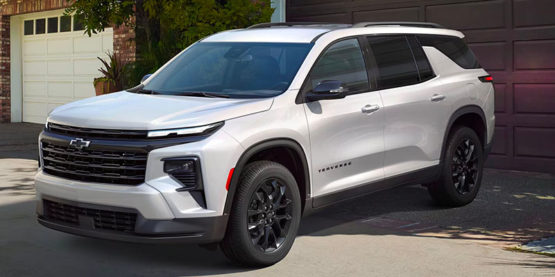 A 2025 Chevrolet Traverse parked outside a home in Benton, AR 