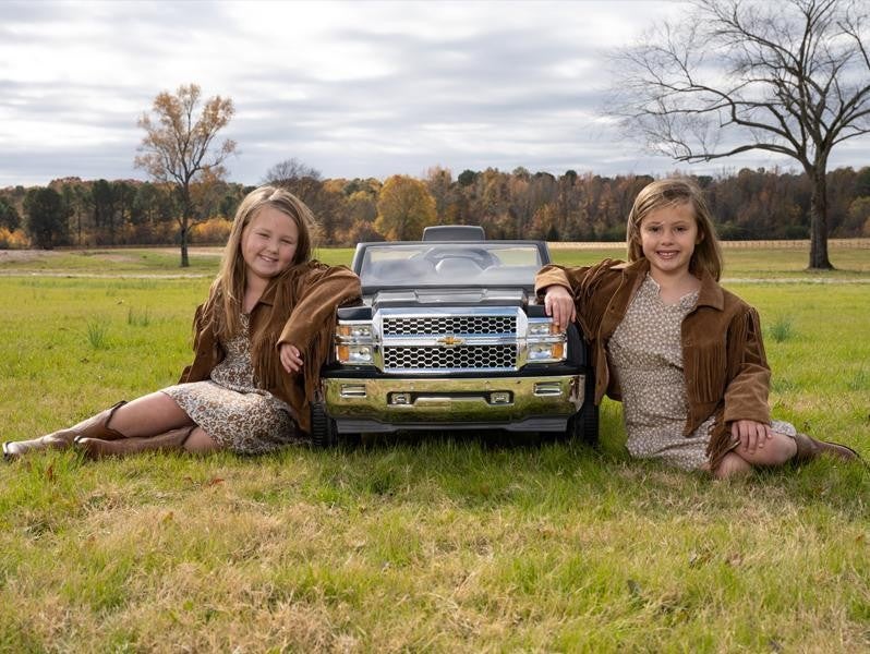 Dwight and Susie Everett grand daughters with kids chevy toy car